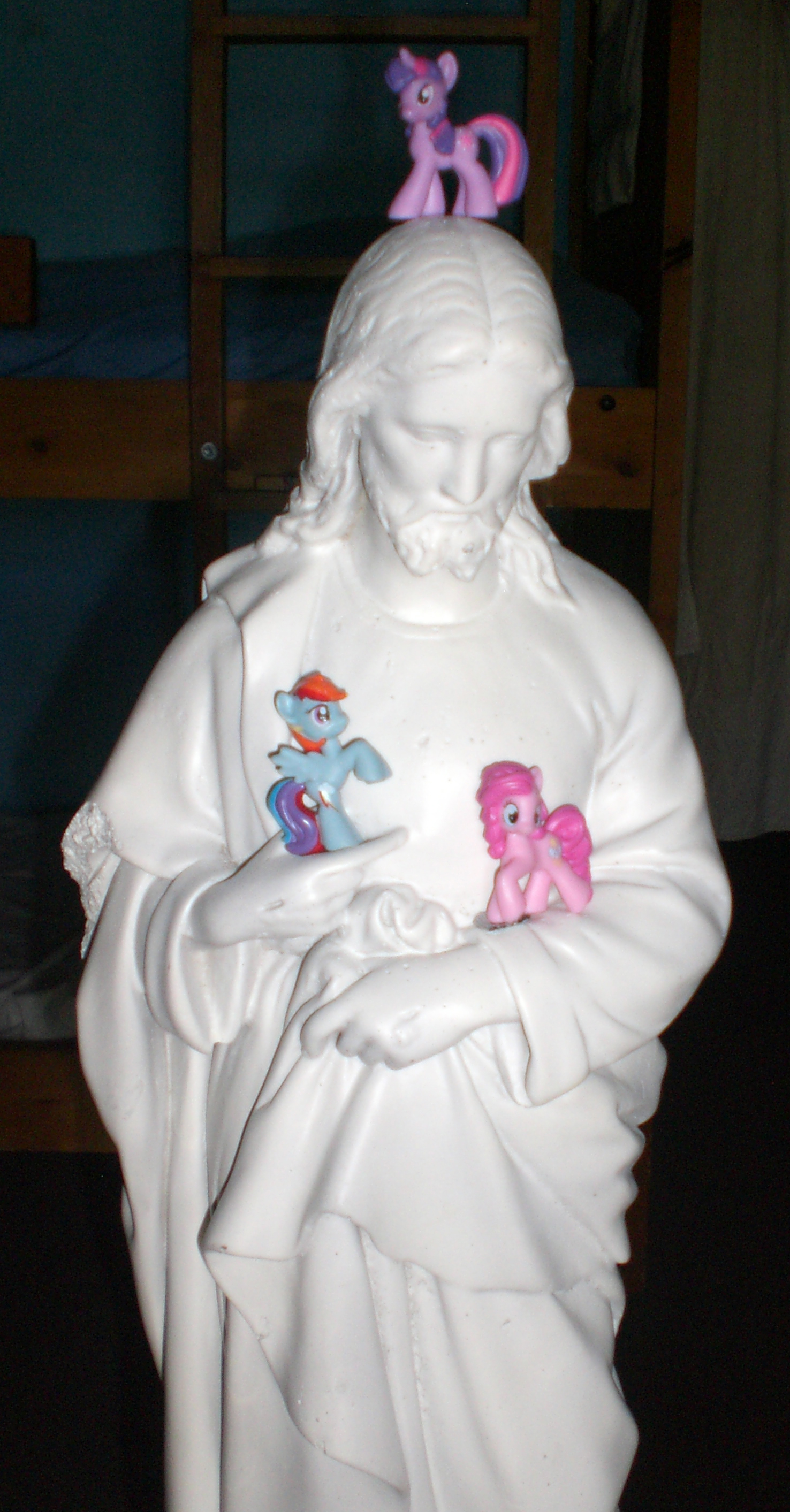 Jesus statue with My Little Ponies