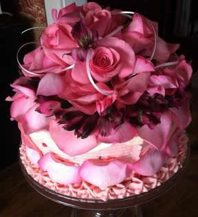 super fancy cake decorated with pink flower petals