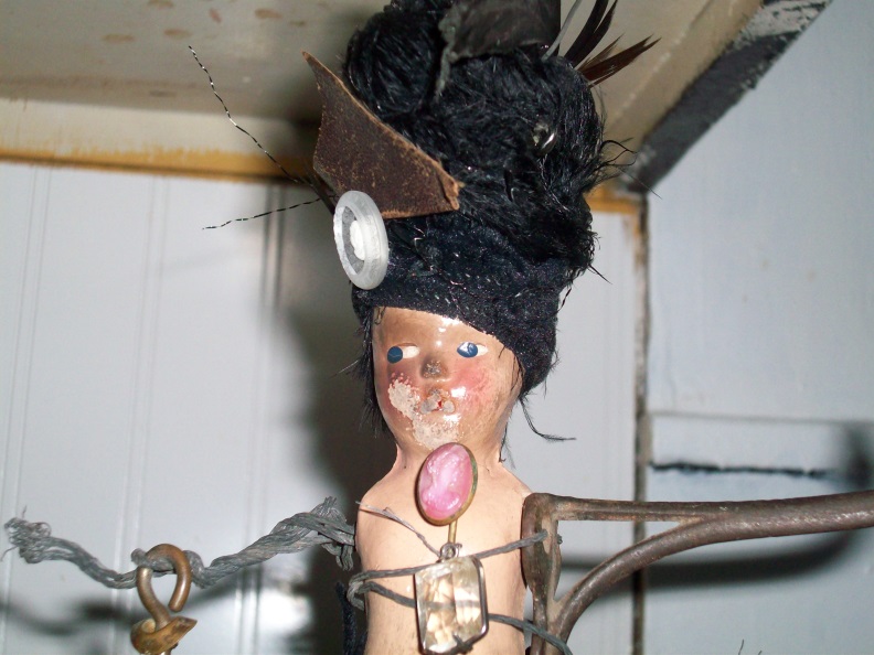 assemblage of doll body with wire and crystals