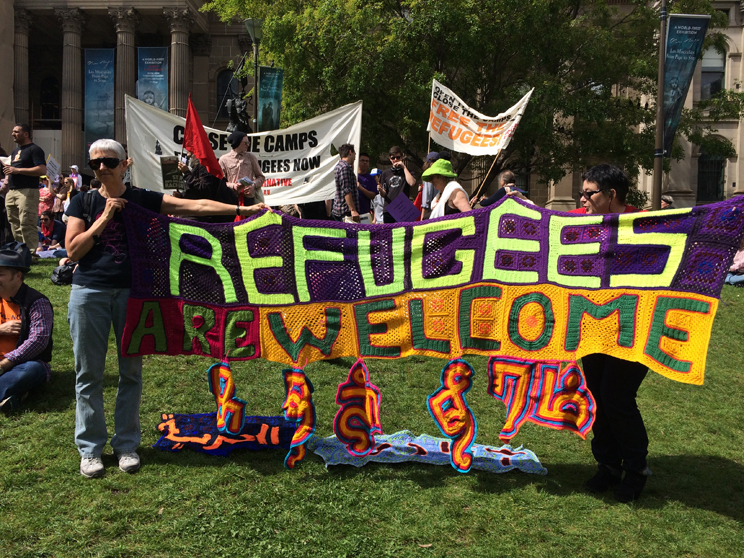 Margaret Mayhew with her rugs at the Refugees Are Welcome rally, October 2014