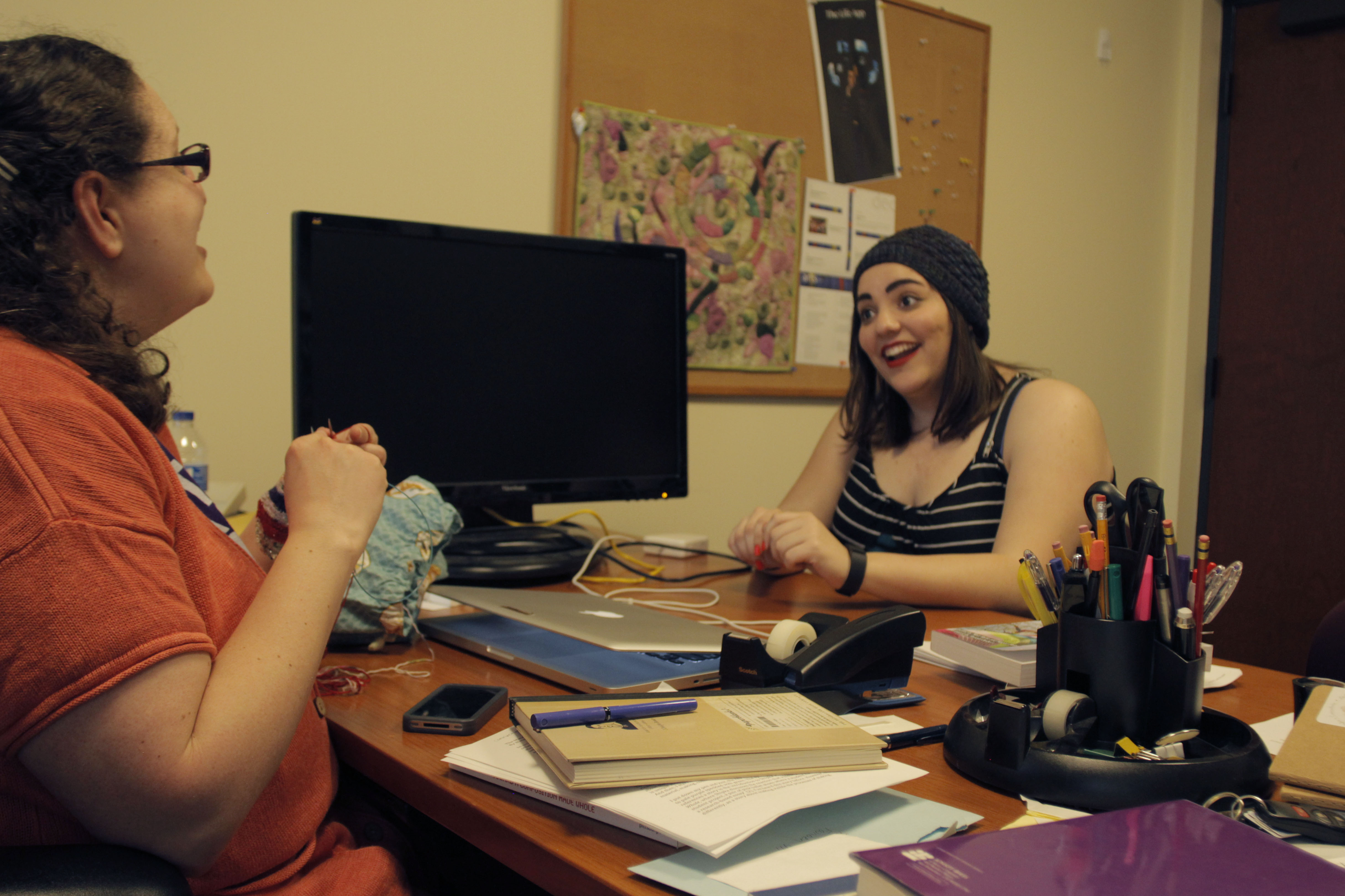 Scarlett and Hannah talking and knitting together