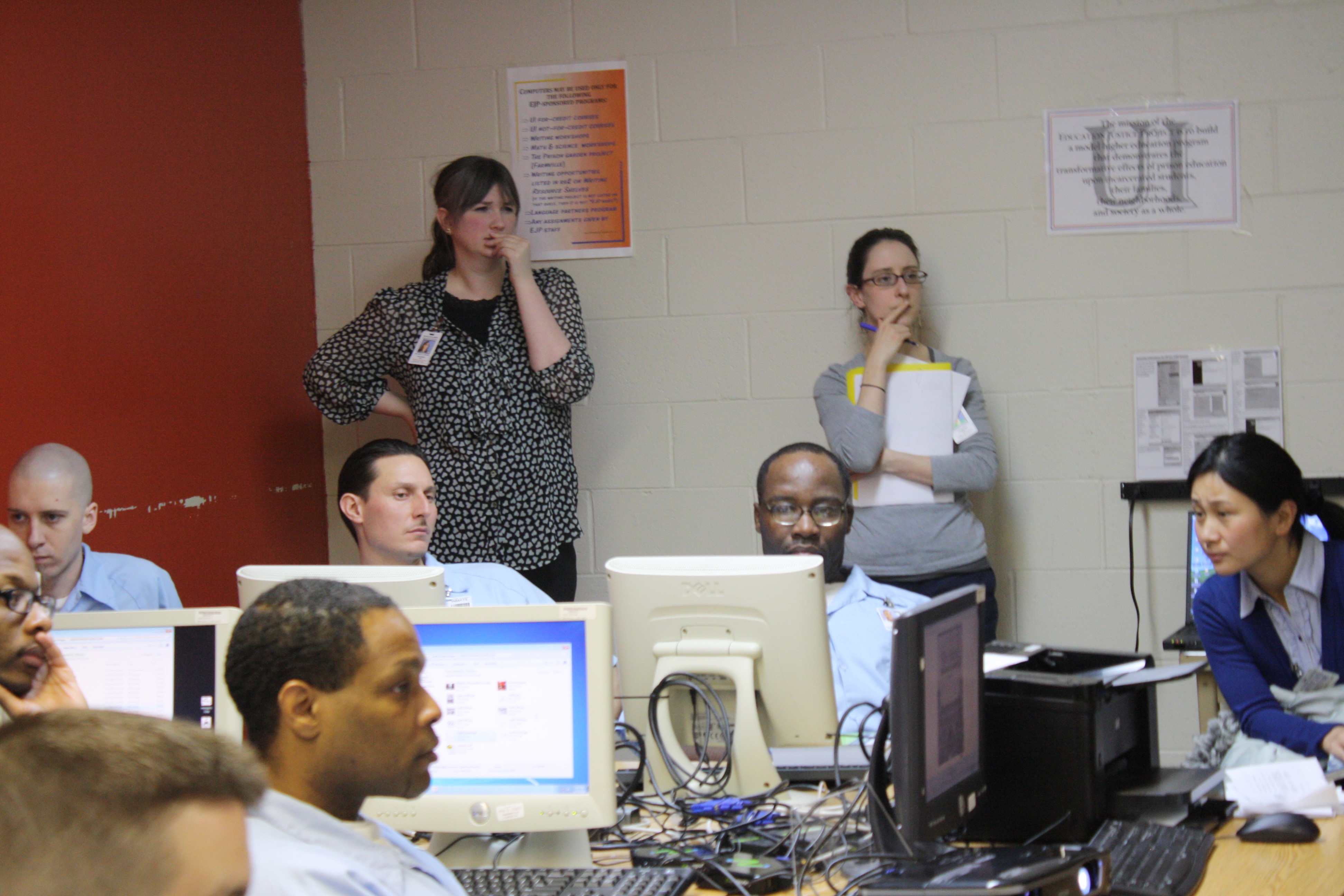 teachers observing from back of room