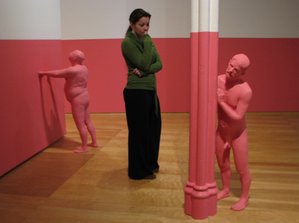 fig 6: gallery observer looking at sculpture of man a third of her size
