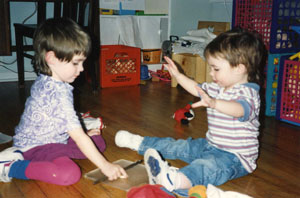 two babies playing